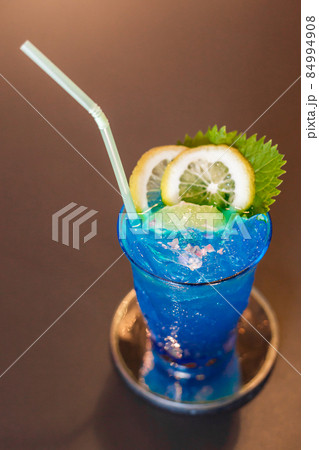 Blue cocktail drink with ice. 84994908
