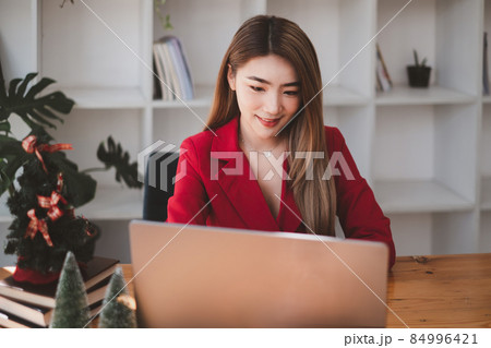 A business woman using laptop computer to cyber security for her saving account, business, technology, future, digital asset Concept. 84996421
