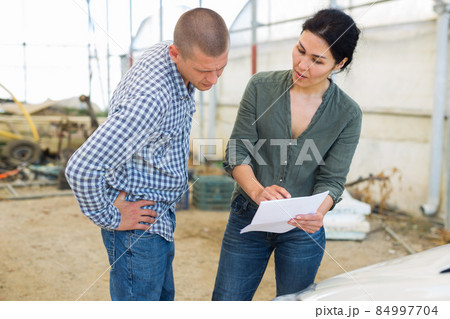 Two people with documents Two people with documents 84997704