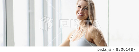 Portrait of happy beautiful sexy athletic perfect female body in sportswear closeup 85001487