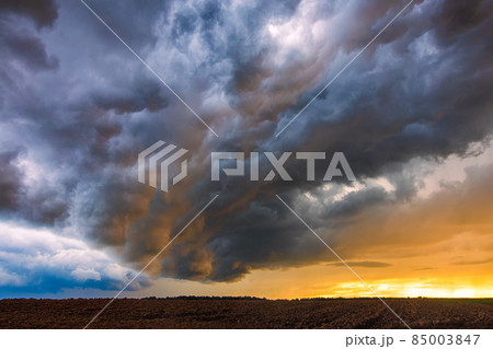 Thunder storm with shelf cloud at sunset, summer, Lithuania Thunder storm with shelf cloud at sunset, summer, Lithuania 85003847