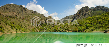 Beautiful sunny valley between the mountains with lush clouds in the Crimea, Ukraine Beautiful sunny valley between the mountains with lush clouds in the Crimea, Ukraine 85004402
