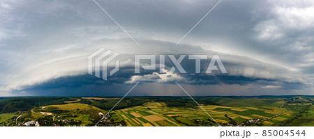 Landscape of dark clouds forming on stormy sky during thunderstorm over rural area. Landscape of dark clouds forming on stormy sky during thunderstorm over rural area. 85004544