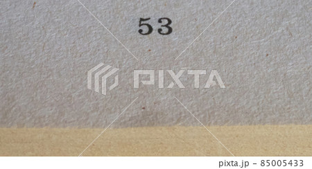 The number 53 printed on a piece of paper. Paper texture. 85005433