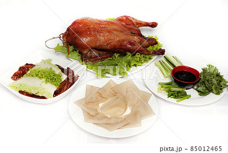 Properly served with Peking duck on white background Properly served with Peking duck on white background 85012465