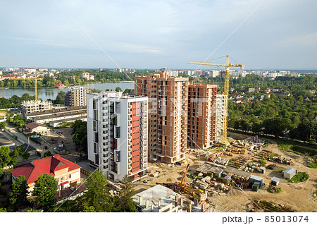 Aerial view of tall residential apartment buildings under construction. Real estate development. 85013074