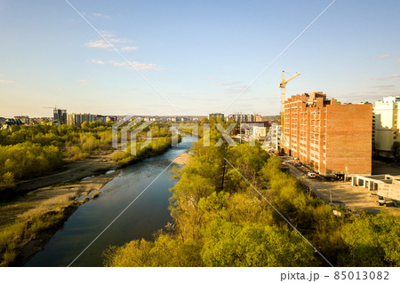 Aerial view of tall residential apartment buildings under construction and Bystrytsia river in Ivano-Frankivsk city, Ukraine. Aerial view of tall residential apartment buildings under construction and Bystrytsia river in Ivano-Frankivsk city, Ukraine. 85013082