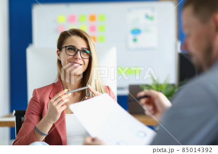 Cheerful optimistic woman listen to colleague report, office worker in suit 85014392