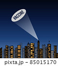 The word vaccine drawn by light in the sky above the city. 85015170