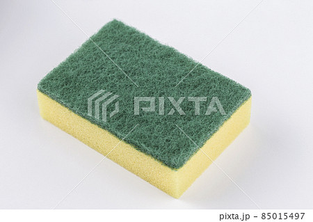 Artificial fibre sponge on a white background. Artificial fibre sponge on a white background. 85015497