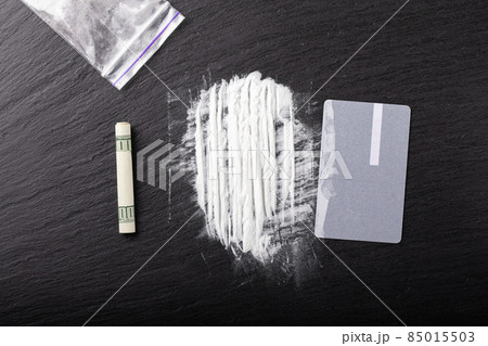 Cocaine or other illegal drugs, white powder, money. Cocaine or other illegal drugs, white powder, money. 85015503