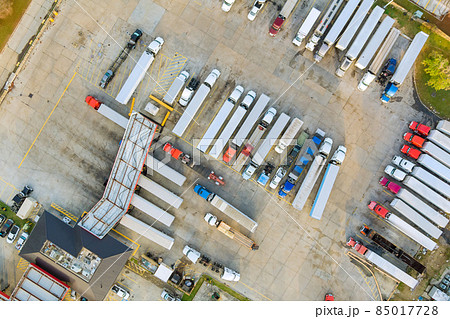 Resting place the truck stop on various types of trucks in a parking lot off the highway Resting place the truck stop on various types of trucks in a parking lot off the highway 85017728