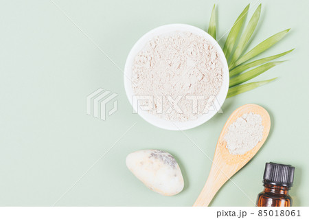 Natural cosmetic clay powder next to essential oil 85018061