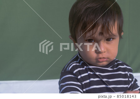 Close up portrait of one cute Sweet little baby looking shock and sad, wonder and feeling surprised about something Indian ethnicity. Head shot. Front view. Copy space for text. Close up portrait of one cute Sweet little baby looking shock and sad, wonder and feeling surprised about something Indian ethnicity. Head shot. Front view. Copy space for text. 85018143