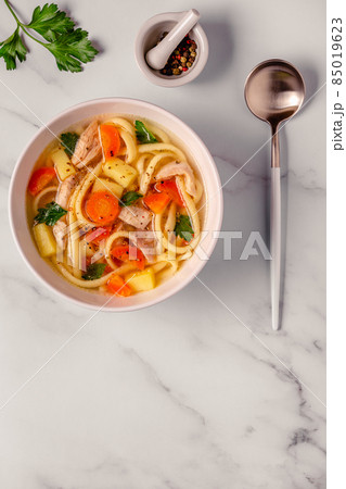 Chicken soup with noodles and vegetables Chicken soup with noodles and vegetables 85019623