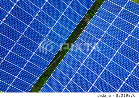 Aerial view of large sustainable electrical power plant with rows of solar photovoltaic panels for producing clean ecological electric energy. Renewable electricity with zero emission concept. 85019876