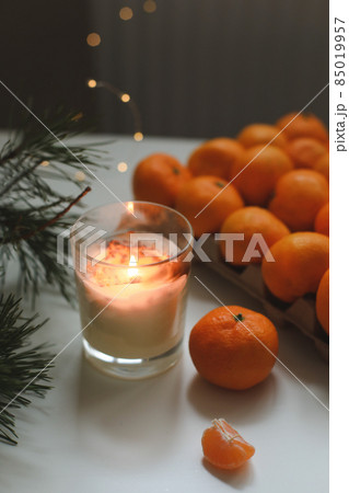 Christmas background with fir tree branches and tangerines. Merry Christmas and Happy New Year Greeting Card Christmas background with fir tree branches and tangerines. Merry Christmas and Happy New Year Greeting Card 85019957