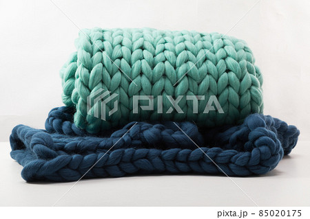two plaids of large coarse knit on a white background from natural sheepskin two plaids of large coarse knit on a white background from natural sheepskin 85020175