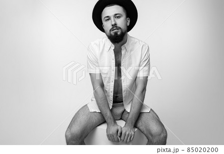 Black and white dramatic photo shot of bearded handsome brutal brunet serious confident brutal man Black and white dramatic photo shot of bearded handsome brutal brunet serious confident brutal man 85020200