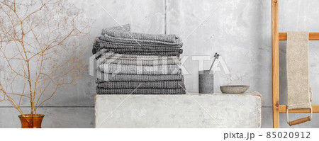 Organic waffle linen towels, bamboo toothbrushes, bathroom zero waste accessories in grey shades in contemporary bathroom interior. Daily body care, spa and wellness zero waste bathroom concept Organic waffle linen towels, bamboo toothbrushes, bathroom zero waste accessories in grey shades in contemporary bathroom interior. Daily body care, spa and wellness zero waste bathroom concept 85020912