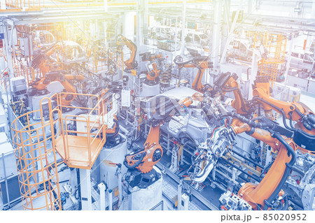 Photo of automobile production line. Welding car body. Modern car assembly plant. Top view in blue Photo of automobile production line. Welding car body. Modern car assembly plant. Top view in blue 85020952