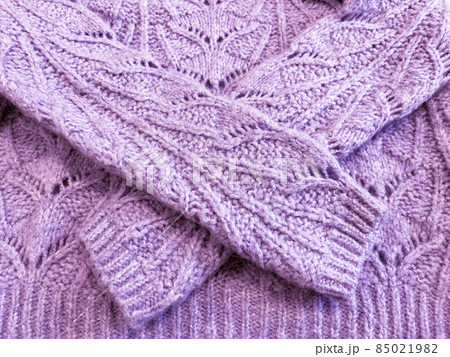 Violet knitted surface close up, concept color of the year 2022. Violet knitted surface close up, concept color of the year 2022. 85021982