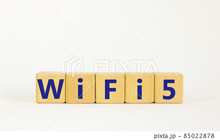 WiFi 5 symbol. The concept word WiFi 5 on wooden cubes. Beautiful white table, white background, copy space. Business, technology and WiFi 5 or WiFi5 concept. WiFi 5 symbol. The concept word WiFi 5 on wooden cubes. Beautiful white table, white background, copy space. Business, technology and WiFi 5 or WiFi5 concept. 85022878