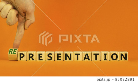 Presentation representation symbol. Businessman turns a cube, changes words presentation to representation. Beautiful orange background, copy space. Business, presentation or representation concept. Presentation representation symbol. Businessman turns a cube, changes words presentation to representation. Beautiful orange background, copy space. Business, presentation or representation concept. 85022891