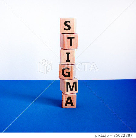 Stigma symbol. Wooden cubes with the word 'stigma'. Beautiful white and blue background. Psychological, medical, business and stigma concept. Copy space. 85022897
