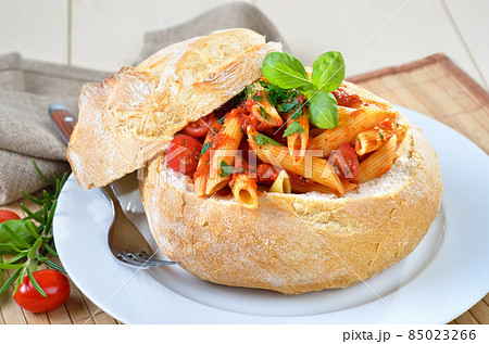 Pasta with tomato sauce filled in Italian ciabatta bread 85023266