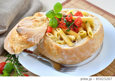 Pasta with tomato sauce filled in Italian ciabatta bread Pasta with tomato sauce filled in Italian ciabatta bread 85023267