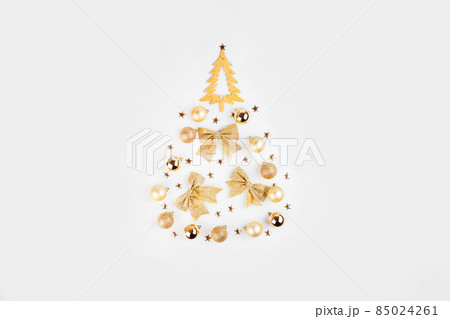 Simple minimalistic Christmas home decor of a wooden Christmas tree.Christmas, winter, new year concept. Simple minimalistic Christmas home decor of a wooden Christmas tree.Christmas, winter, new year concept. 85024261