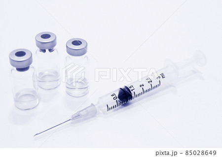 Vial of Drug and 3 ml Plastic Syringe with Needle Isolated on the White Background Vial of Drug and 3 ml Plastic Syringe with Needle Isolated on the White Background 85028649