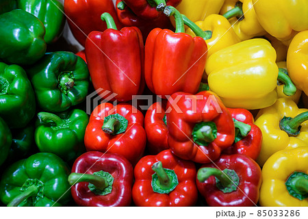 Fresh red green and yellow sweet bell peppers sale in market Fresh red green and yellow sweet bell peppers sale in market 85033286