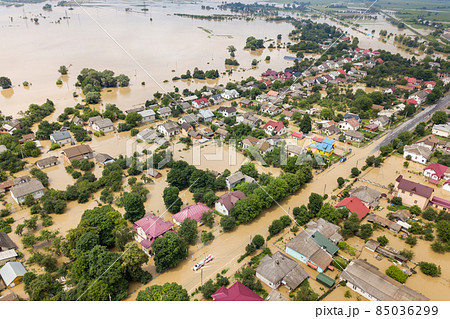 Aerial view of flooded houses with dirty water of Dnister river in Halych town, western Ukraine. 85036299