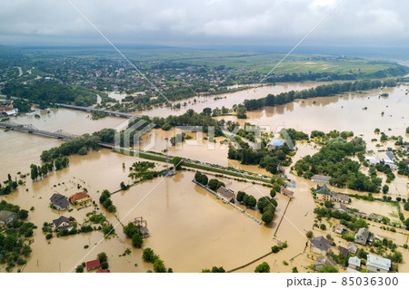 Aerial view of flooded houses with dirty water of Dnister river in Halych town, western Ukraine. 85036300