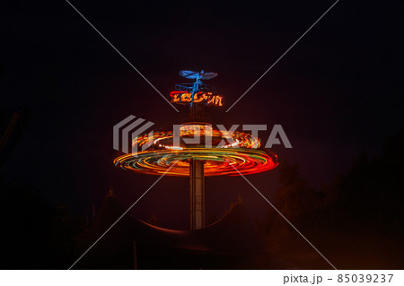 Kouvola, Finland - 28 August 2021: Rotating ride Taifun in amusement park Tykkimaki at night 85039237