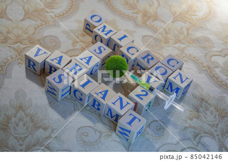 Omicron. Natural wood cubes with blue letters 85042146