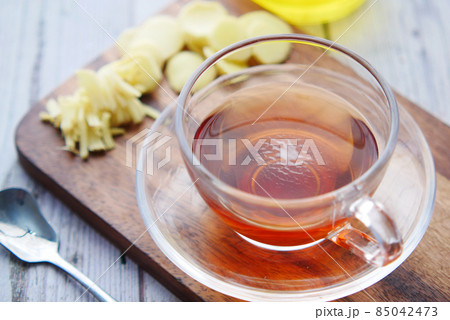 Top view of ginger tea on wooden background. 85042473