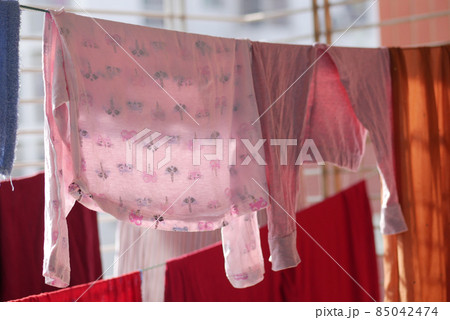child clothes line filled with hanging trousers 85042474