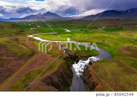 Aerial view of Reykjafoss waterfall located near Varmahlid in Iceland Aerial view of Reykjafoss waterfall located near Varmahlid in Iceland 85042549