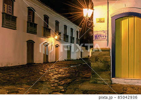 Cobblestone street and reflections in puddles in the historic city of Paraty Cobblestone street and reflections in puddles in the historic city of Paraty 85042936