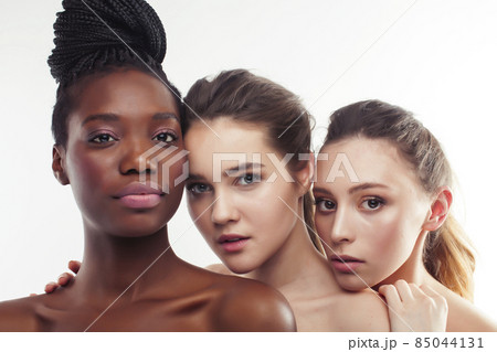 three different nation woman: african-american, caucasian together isolated on white background happy smiling, diverse type on skin, lifestyle real people concept three different nation woman: african-american, caucasian together isolated on white background happy smiling, diverse type on skin, lifestyle real people concept 85044131