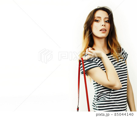 young pretty teenage hipster girl posing emotional happy smiling on white background, lifestyle people concept young pretty teenage hipster girl posing emotional happy smiling on white background, lifestyle people concept 85044140
