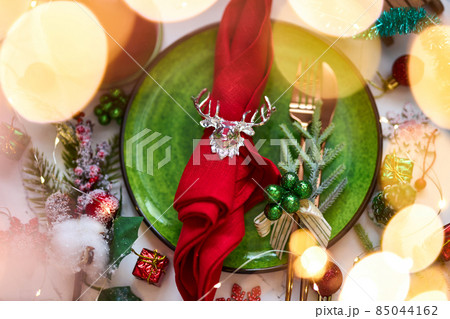 Traditional Christmas table place setting. Holidays background. Traditional Christmas table place setting. Holidays background. 85044162