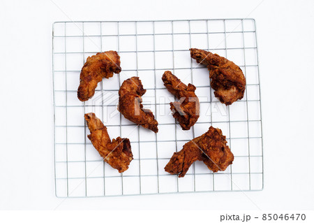 Fried chicken necks on white background. Fried chicken necks on white background. 85046470