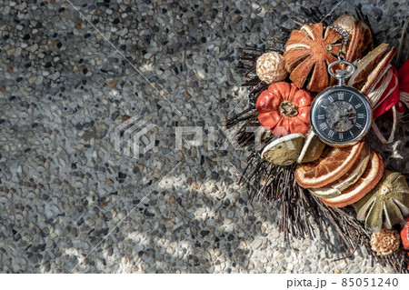 Half of heart with a pocket watch put on the area to looking for the other half to complete it. 85051240