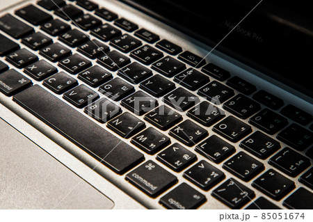 Close-up detail view of a laptop keyboard on the keys with high contrast and shallow depth of field. 85051674