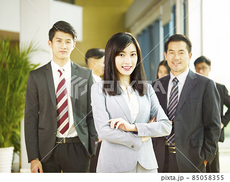 portrait of a team of successful asian businessmen and businesswomen, looking at camera smiling portrait of a team of successful asian businessmen and businesswomen, looking at camera smiling 85058355