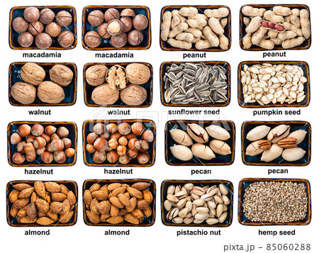 set of various unhusked nuts in bowls with names 85060288